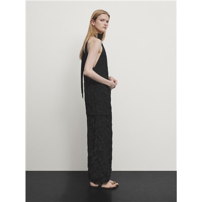 Long pleated halterneck dress