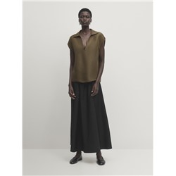 Blusa sin mangas cuello polo