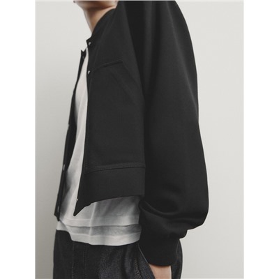 Chaqueta bomber corta botones snaps