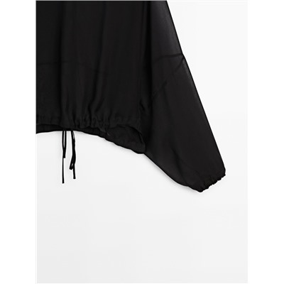 Blusa semitransparente cordón