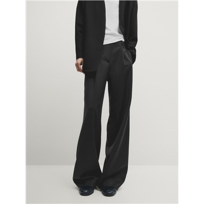 Pantalón traje ancho pinzas