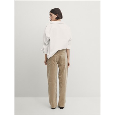 Pantalón micropana slim fit detalle costura