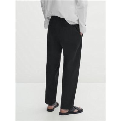 Pantalón detalle bolsillo relaxed fit