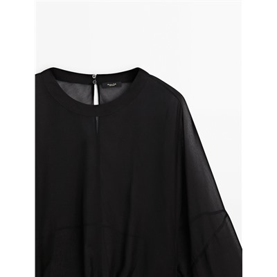 Blusa semitransparente cordón