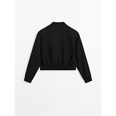 Chaqueta bomber corta botones snaps