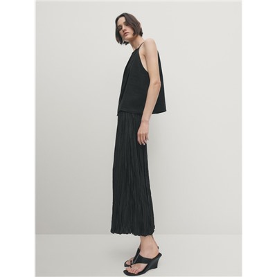 Falda midi negra plisada