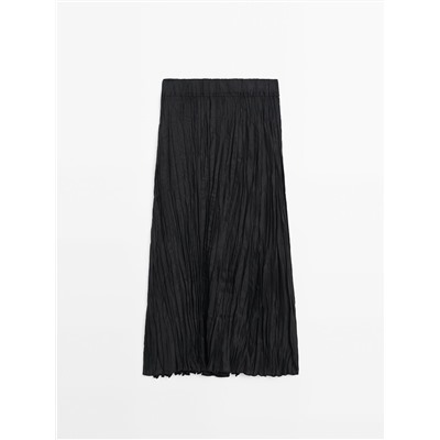 Falda midi negra plisada