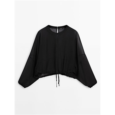 Blusa semitransparente cordón