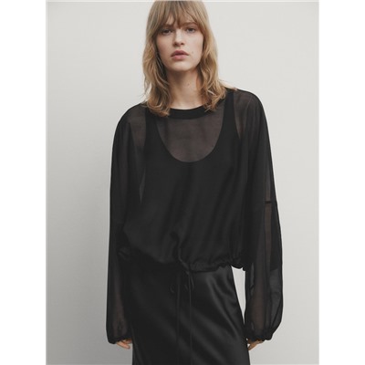 Blusa semitransparente cordón