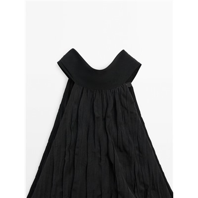Long pleated halterneck dress