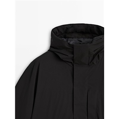 Parka negra relleno plumón y plumas capucha