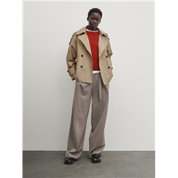 Gabardina corta detalle puño