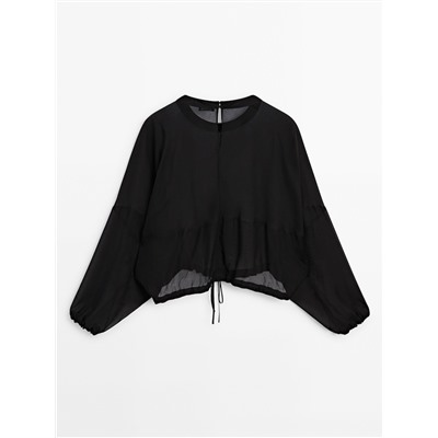 Blusa semitransparente cordón