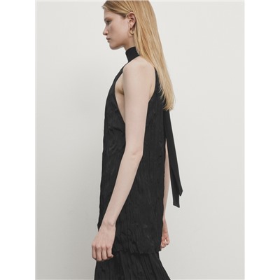 Long pleated halterneck dress