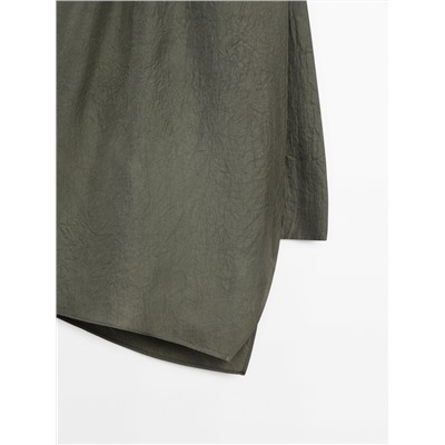 Top asimétrico cuello halter