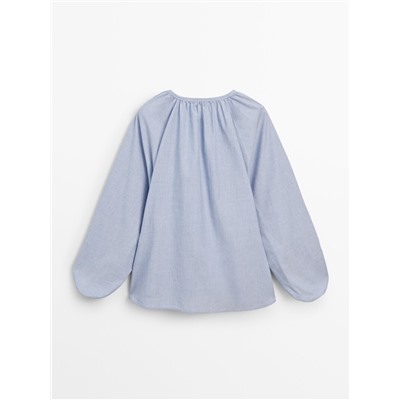 Blusa efecto arrugado