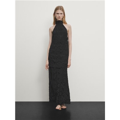Long pleated halterneck dress