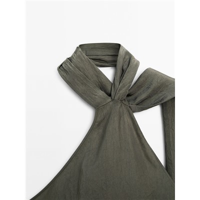 Top asimétrico cuello halter
