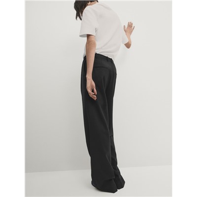 Pantalón traje ancho pinzas