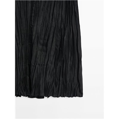Falda midi negra plisada