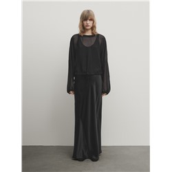 Blusa semitransparente cordón